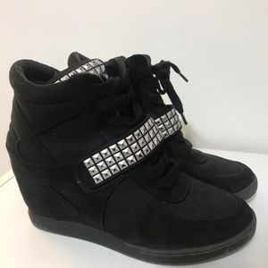 Studded black wedges